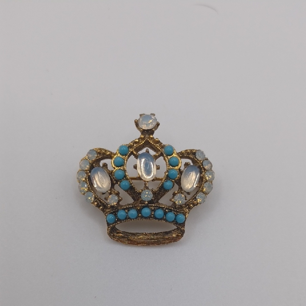 Gold Tone Crown Brooch With Blue and Faux Opalescent Accents